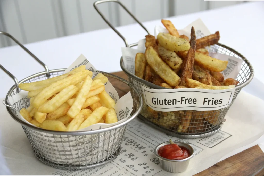 Illustrate a side-by-side visual comparing a basket of Five Guys fries with gluten-free labels and another basket labeled for cross-contamination risk, clearly emphasizing the difference.